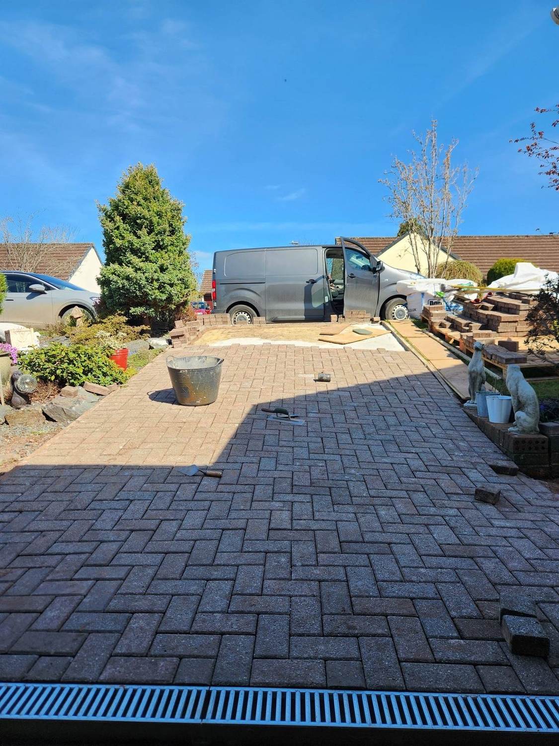 New block-paved driveway with PRIME van parked at the kerb