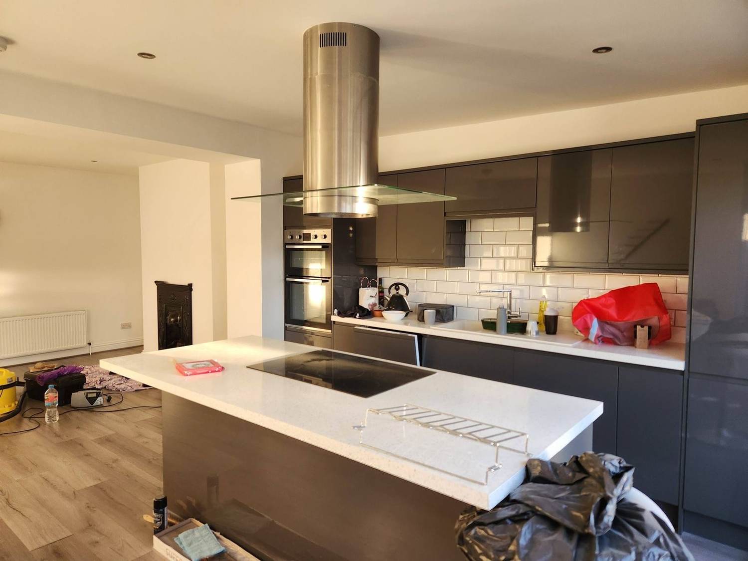 Modern grey kitchen with island, hood and induction hob