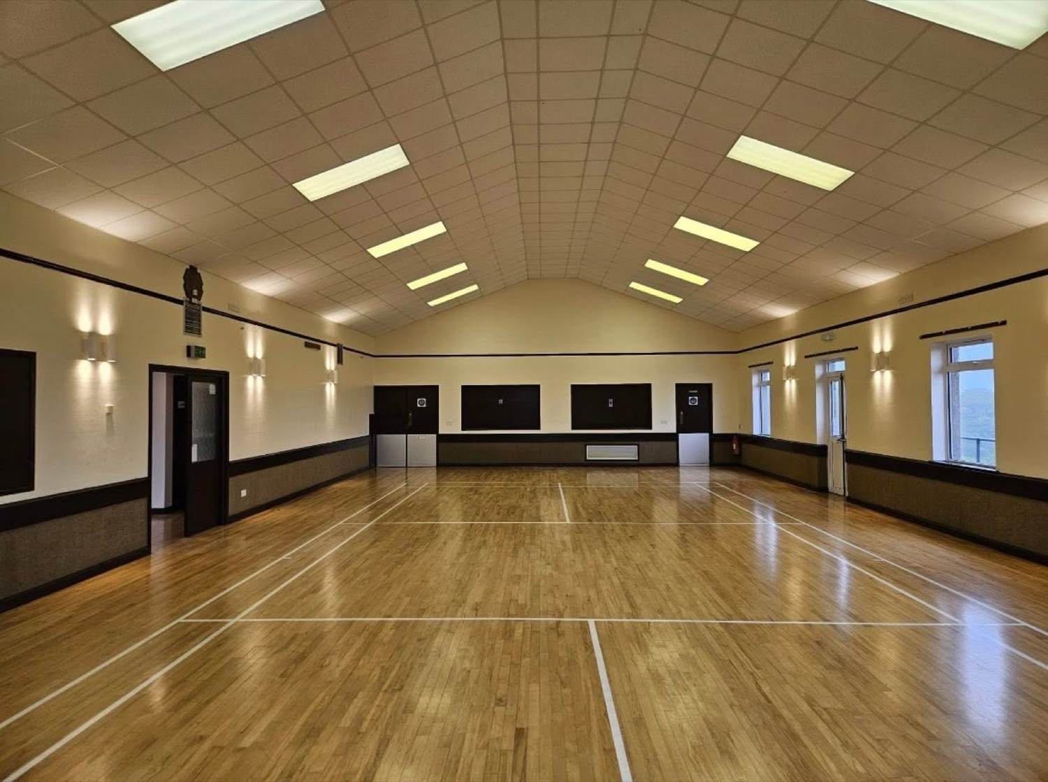 Village hall after refit — fresh paintwork and sports-marked floor