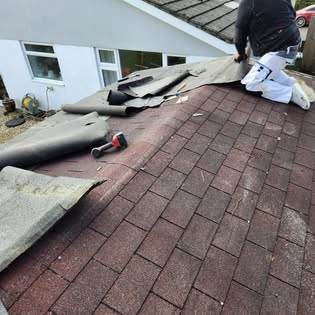 Garage roof replacement — new boards, felt, fascias and guttering